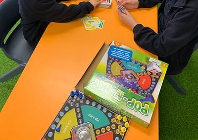 Students playing board games together