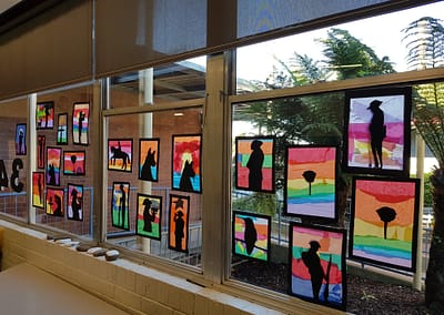Brightly coloured artwork on the classroom window with silhouettes of ANZAC symbols