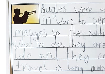 Photo of student writing about bugles